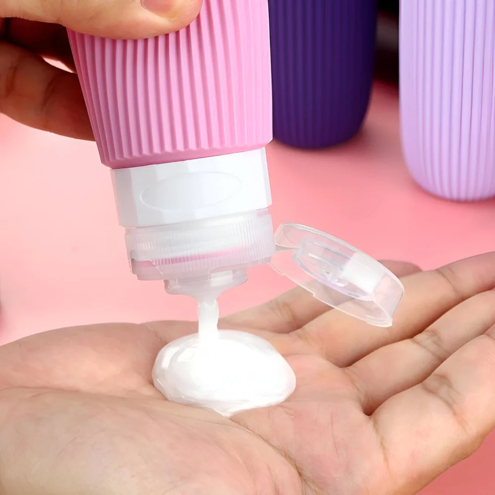 Reiseflaschen Set 4×90 ml mit transparentem Kulturbeutel – auslaufsichere Silikonflaschen zum Nachfüllen für Shampoo Duschgel & Lotion