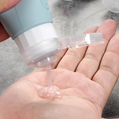 Reiseflaschen Set 4×90 ml mit transparentem Kulturbeutel – auslaufsichere Silikonflaschen zum Nachfüllen für Shampoo Duschgel & Lotion